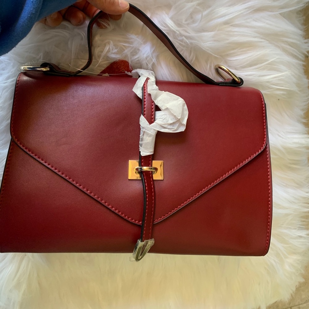 Burgundy top handle bag.